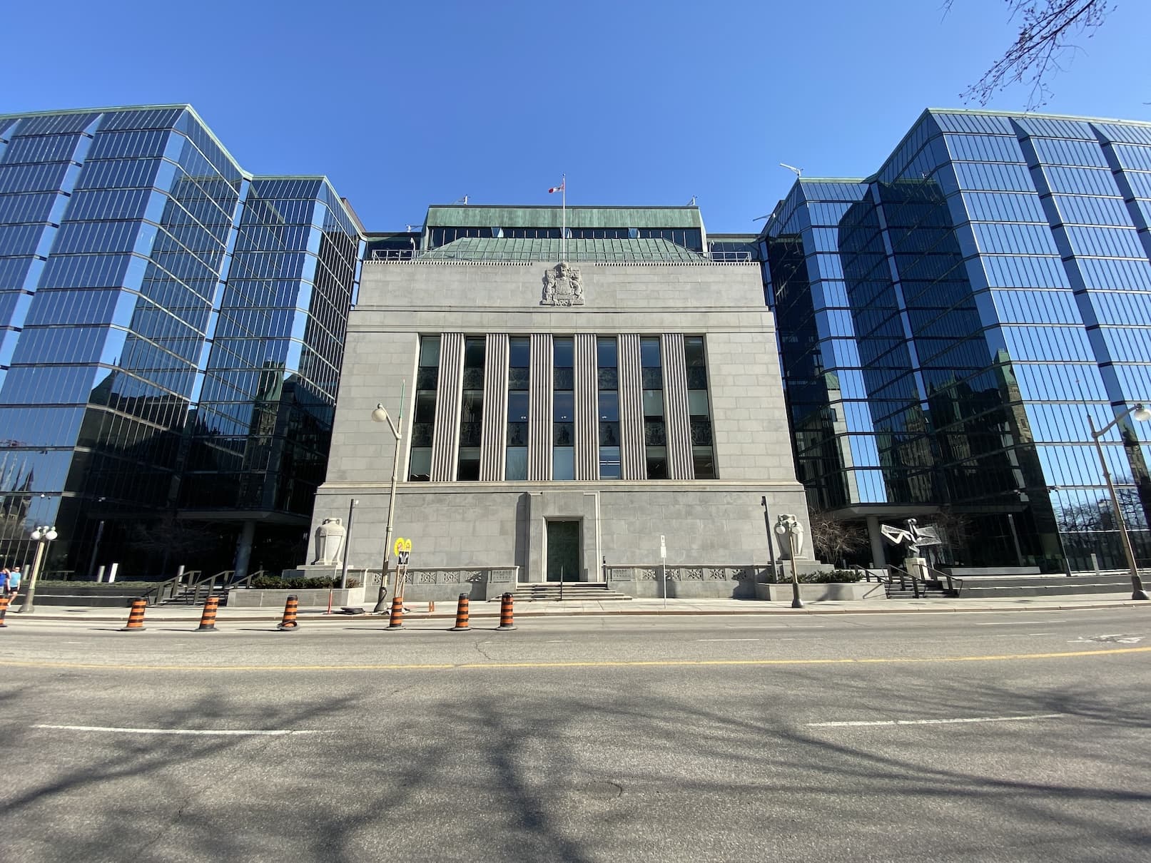 Facade of a modern Canadian bank building under a clear blue sky.