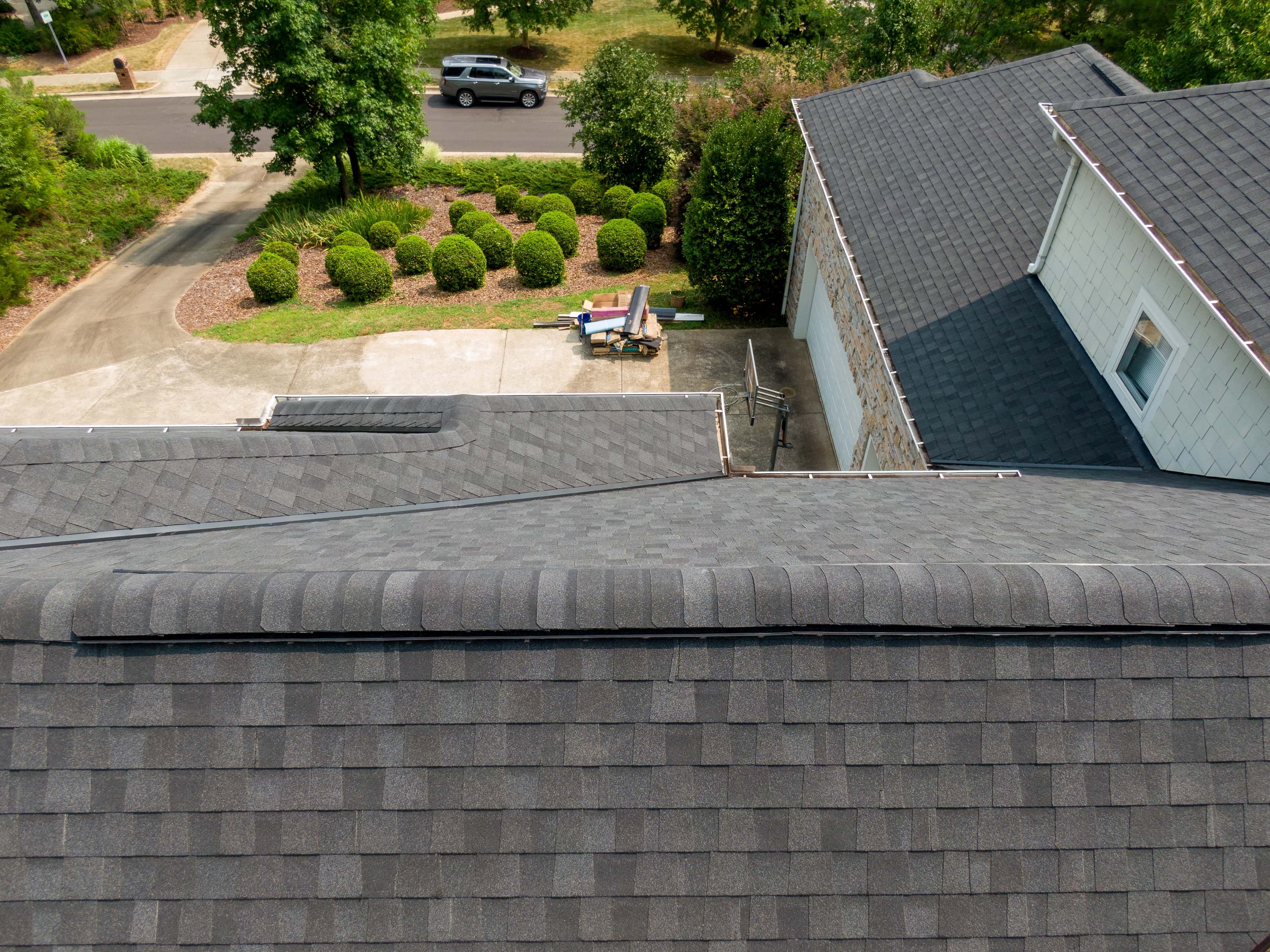 Aerial view of asphalt shingle roof on a residential home.