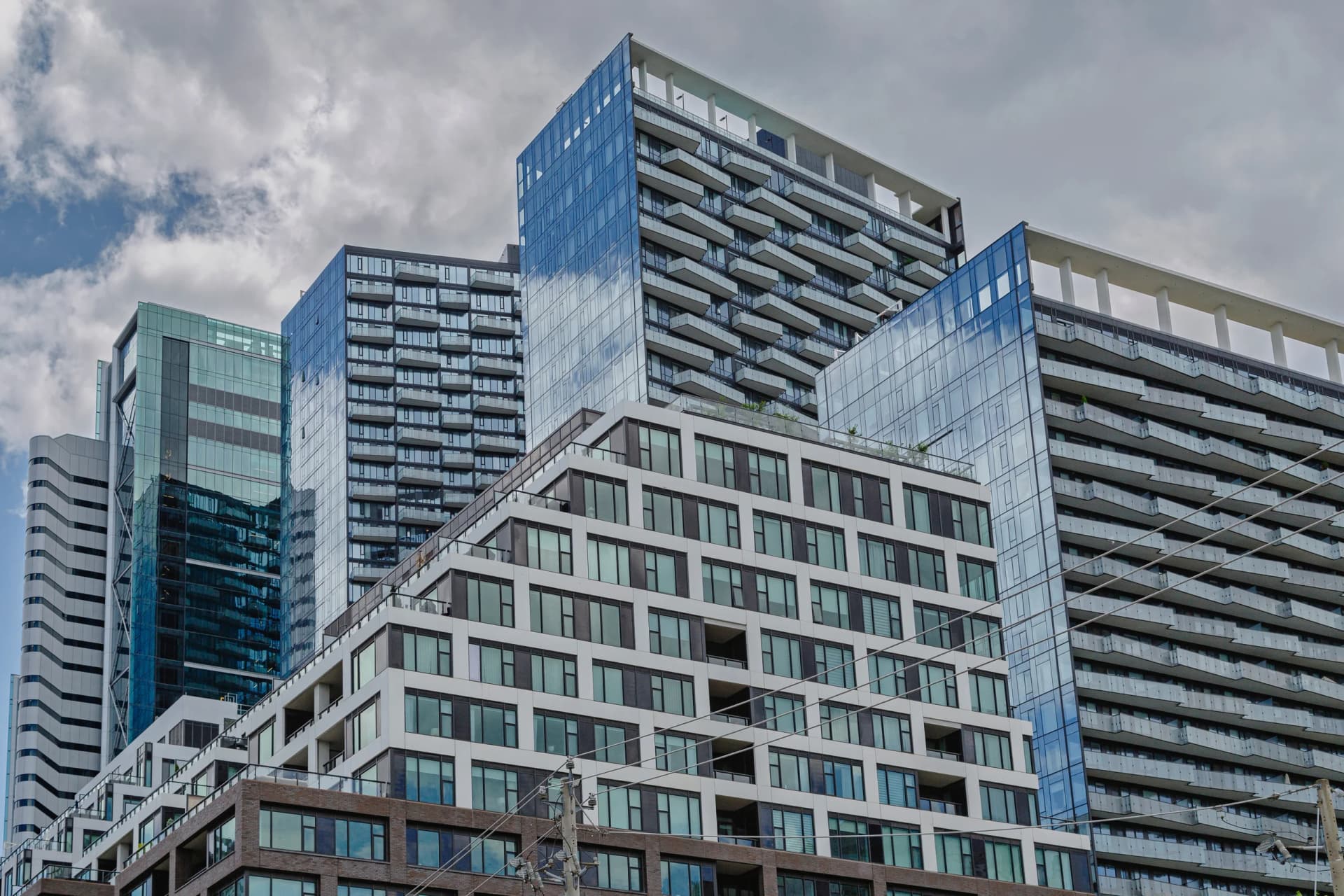 Condo Benchmarks Fell 6.7 Per Cent in Toronto and 8.3 in Calgary While Detached Barely Moved